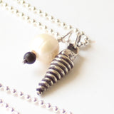 Bead and sterling silver charm necklace